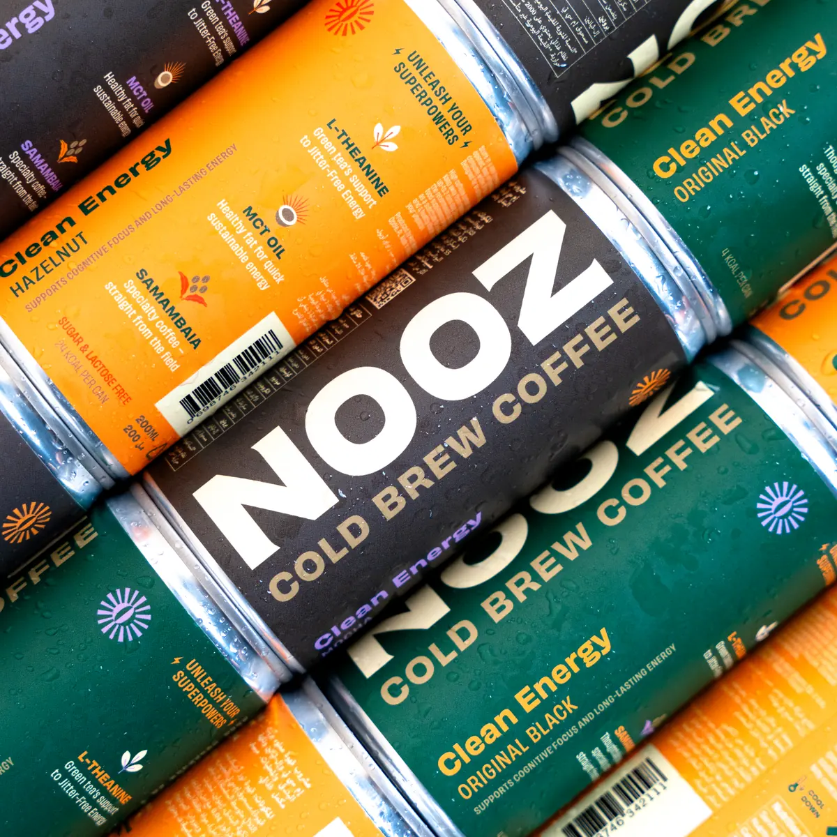 NOOZ cans stacked to show the full pack design
